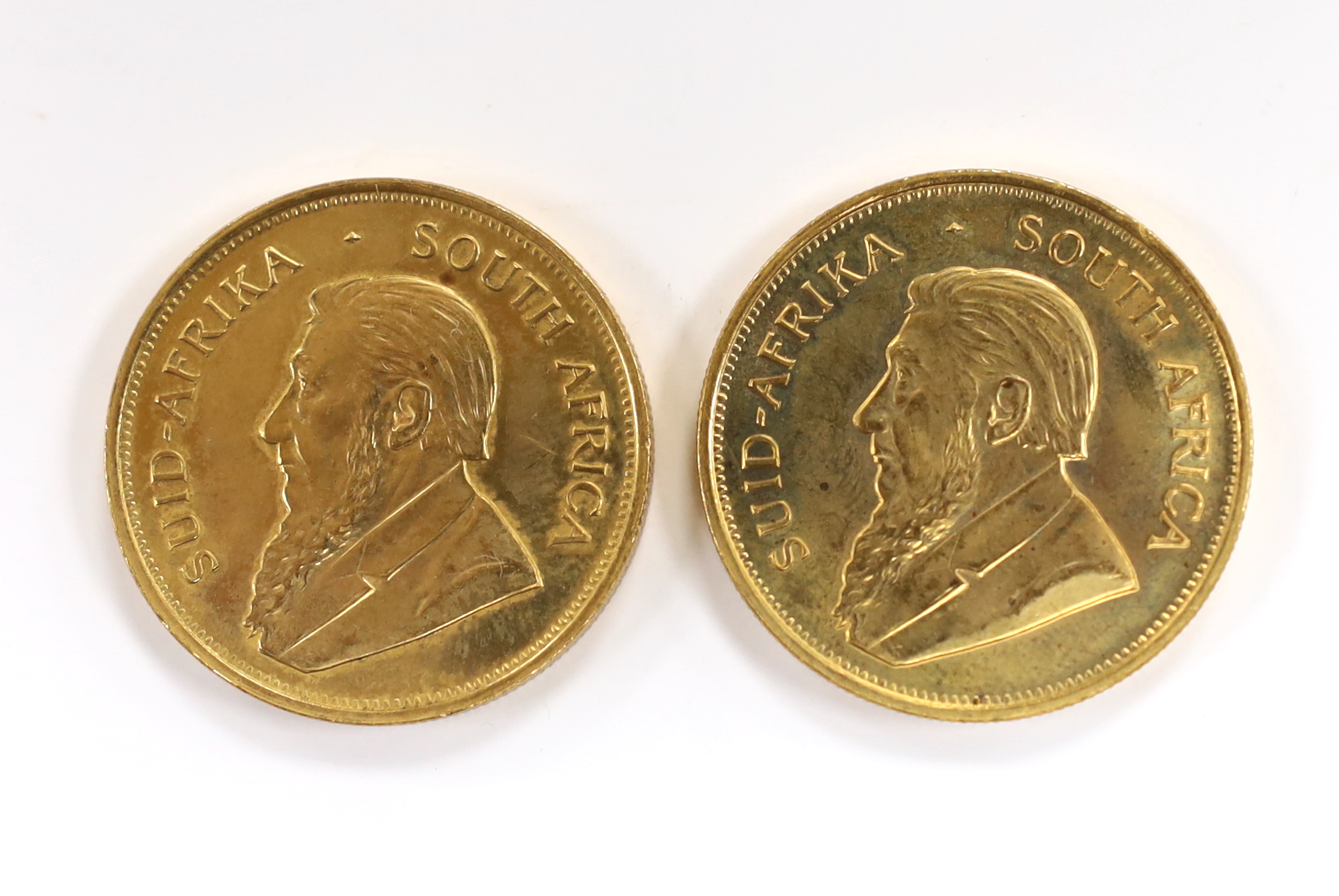 Gold coins, South Africa, two gold 1oz. Krugerrands, 1975, near UNC (2oz.)